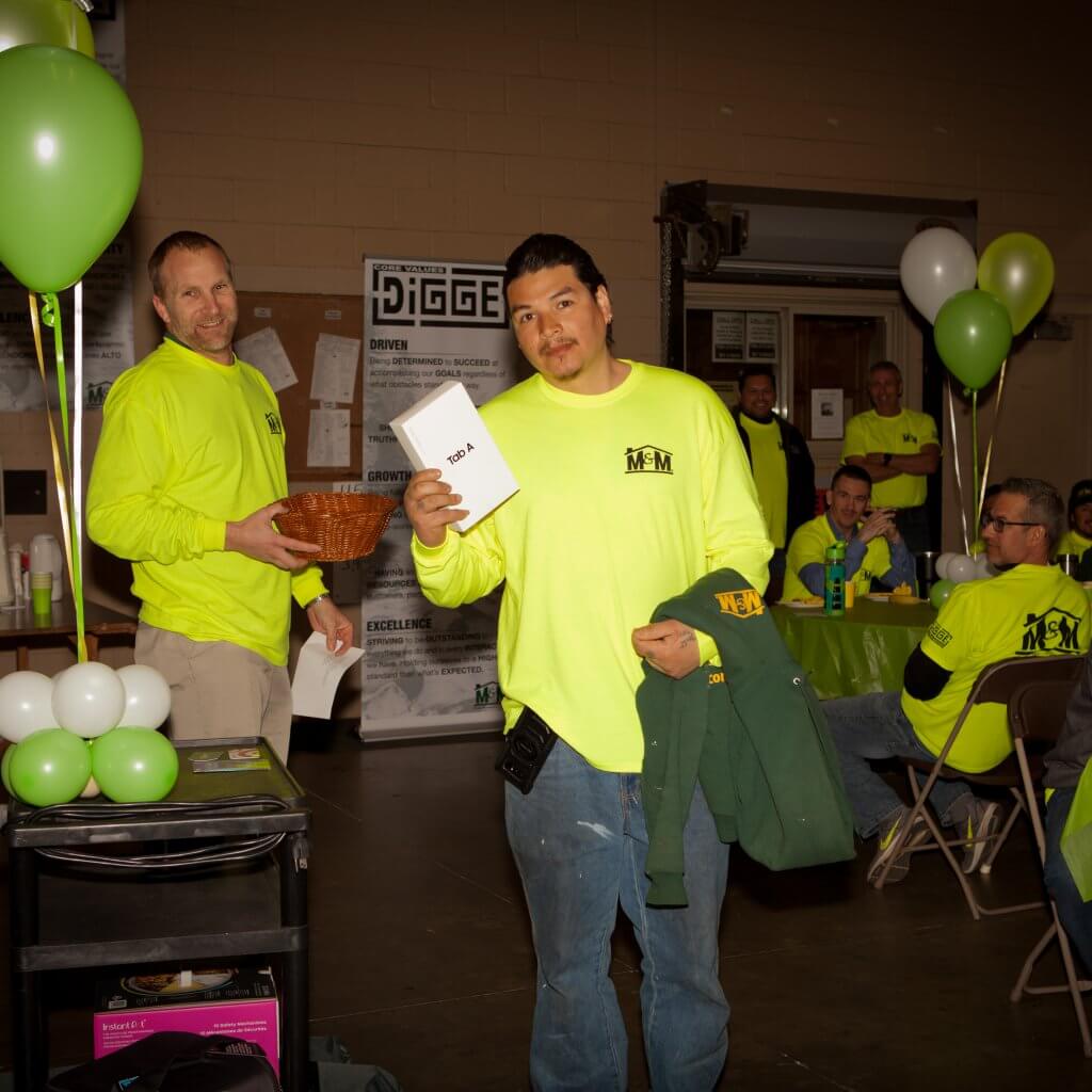 man with tablet and jacket