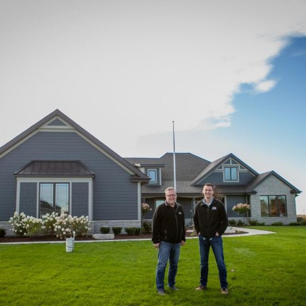 two man in front of the house