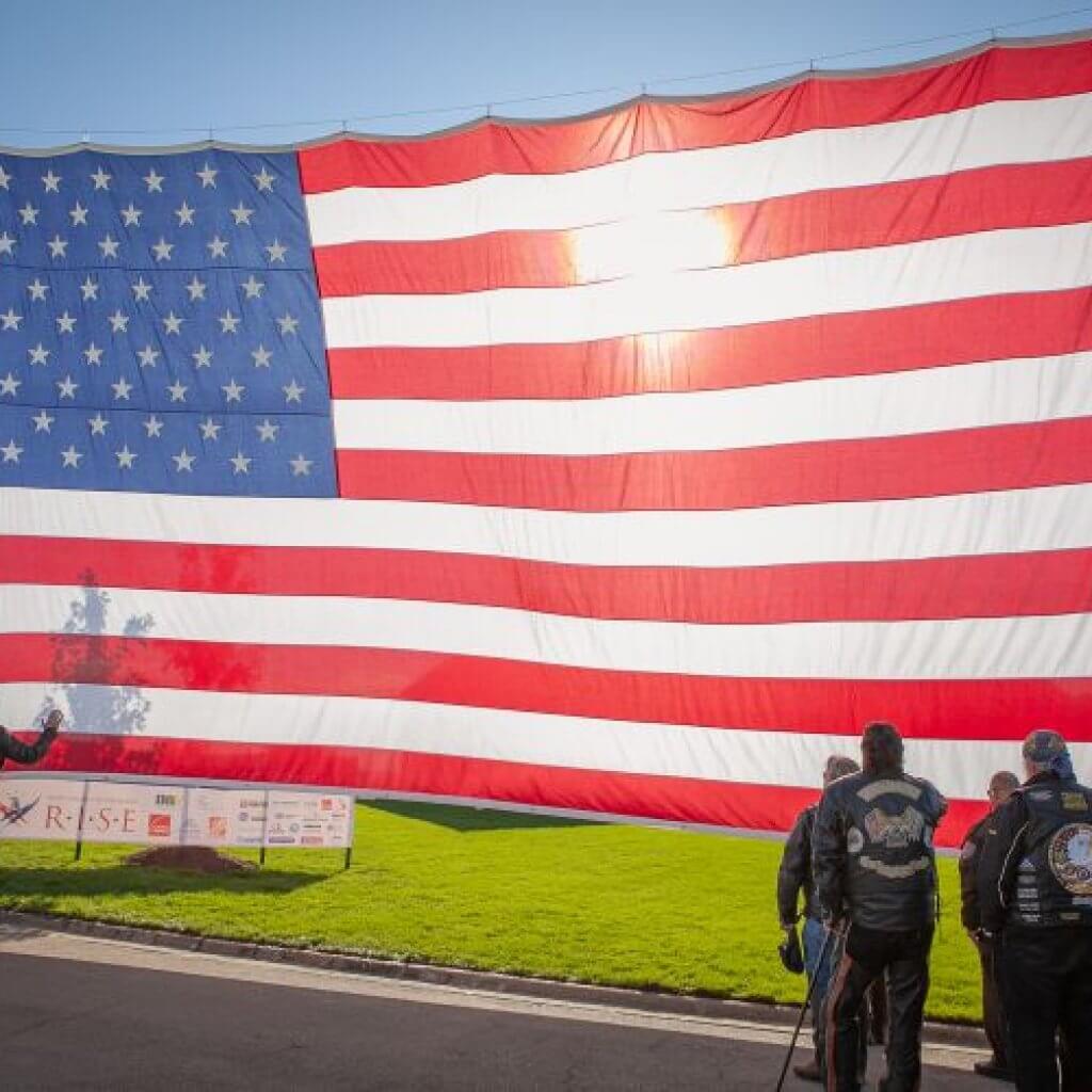 people infront of the usa flag