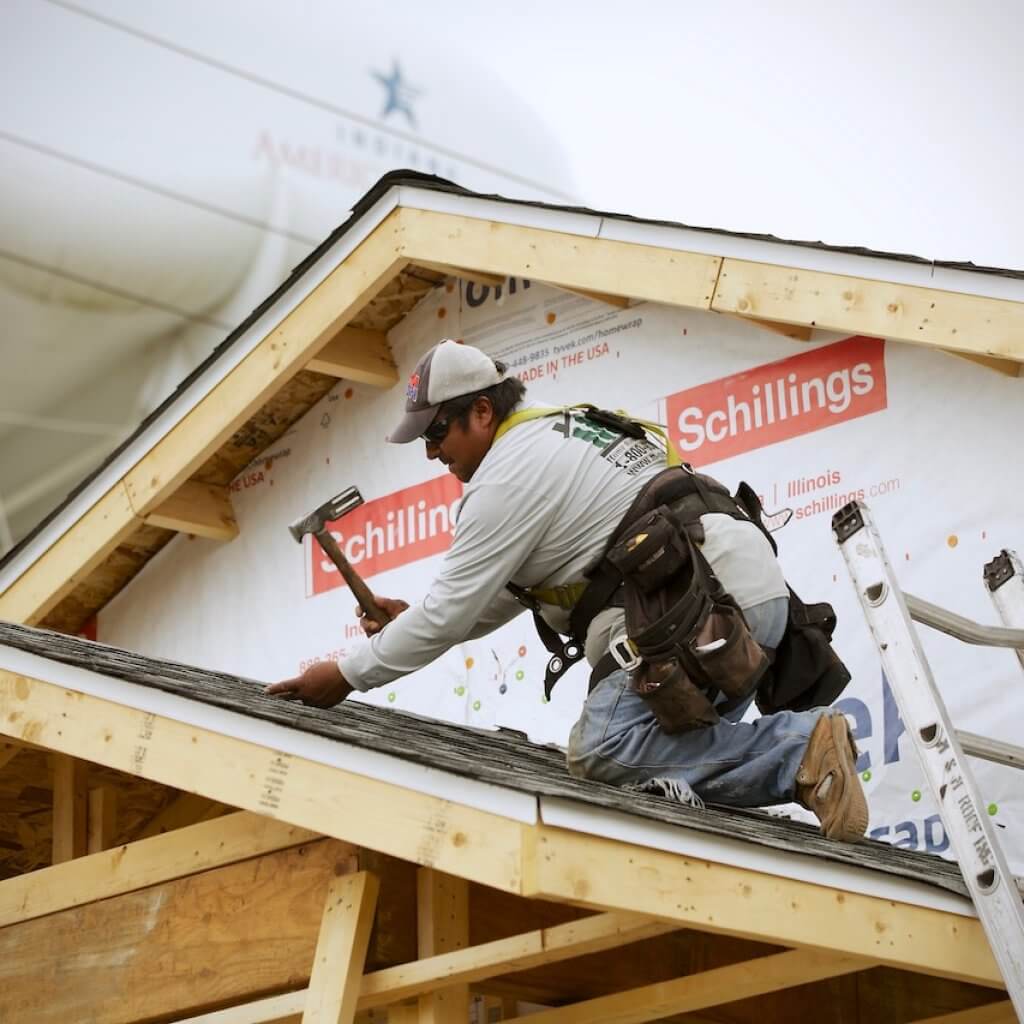 man fixing the roofing