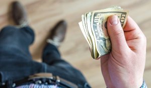 man holding dollars
