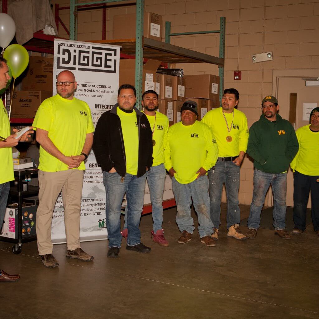 m-m employee standing and listening to the man speaking